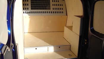 Inside back of van showing ply lining and floor drawers